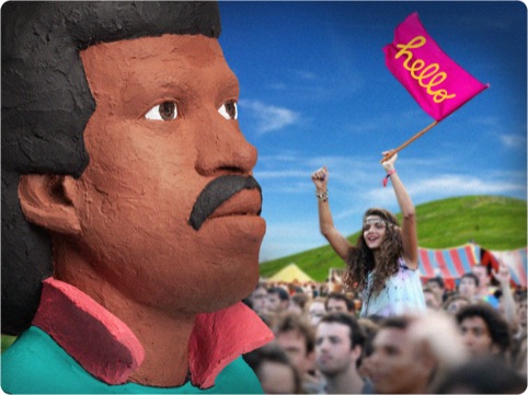 A reveller celebrates Lionel Richie's massive head