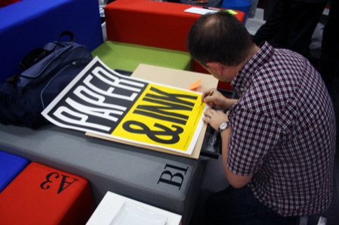 Anthony Burill with one of the prints