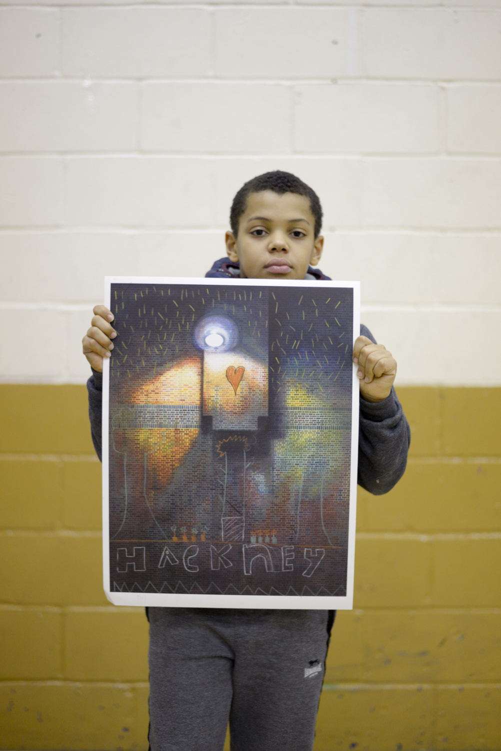 A workshop participant with his artwork