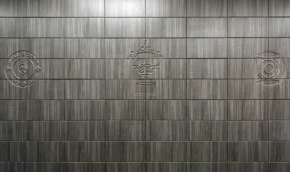 An engraved wall shows the England rugby team's achievements