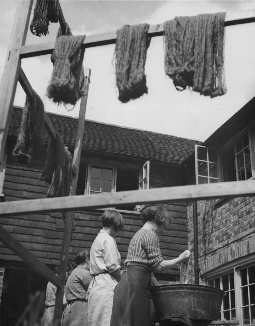 A Bold Experiment: work and play at Ditchling Guild Guild members in the weaving workshop