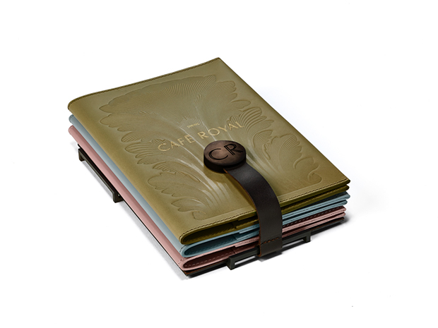 Tray found in-rooms, featuring an integrated paper weight