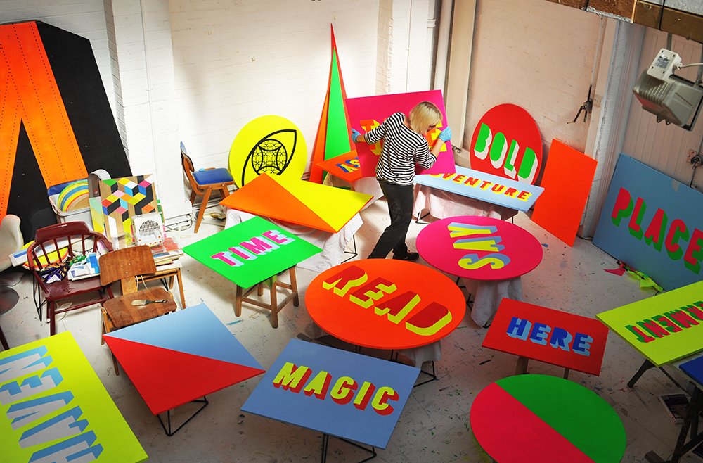 Morag Myerscough painting signs at Studio Myerscough