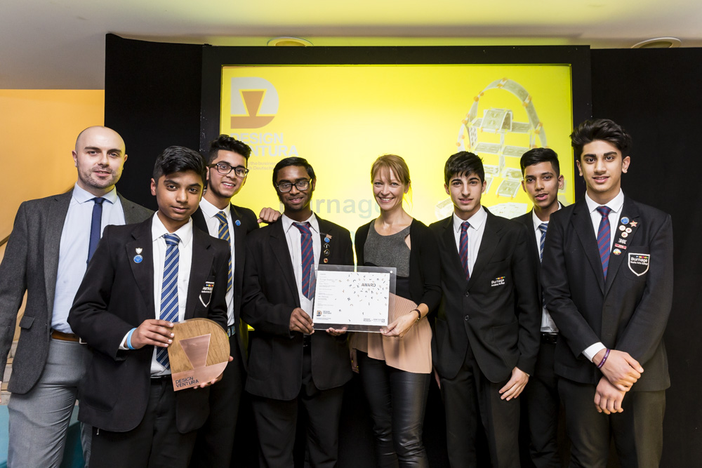 The team receive their award from Naomi Cleaver