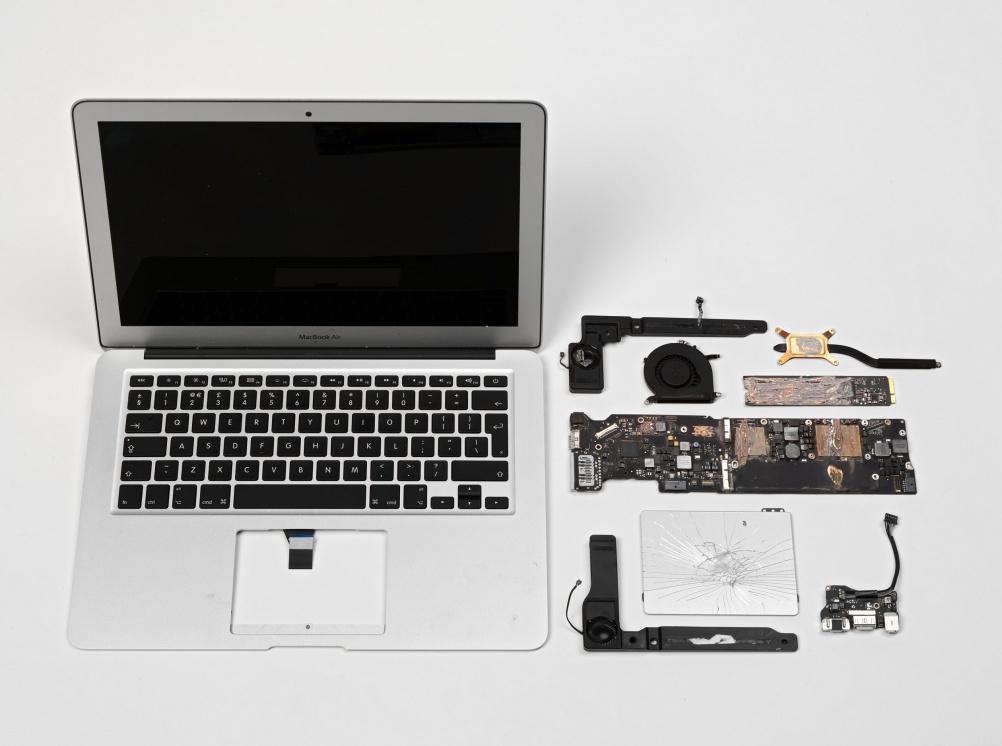 MacBook Air casing and components from a computer used by journalists to write editorial about the data leaked to The Guardian newspaper by Edward Snowden © The Guardian/ Victoria & Albert Museum, London 2015