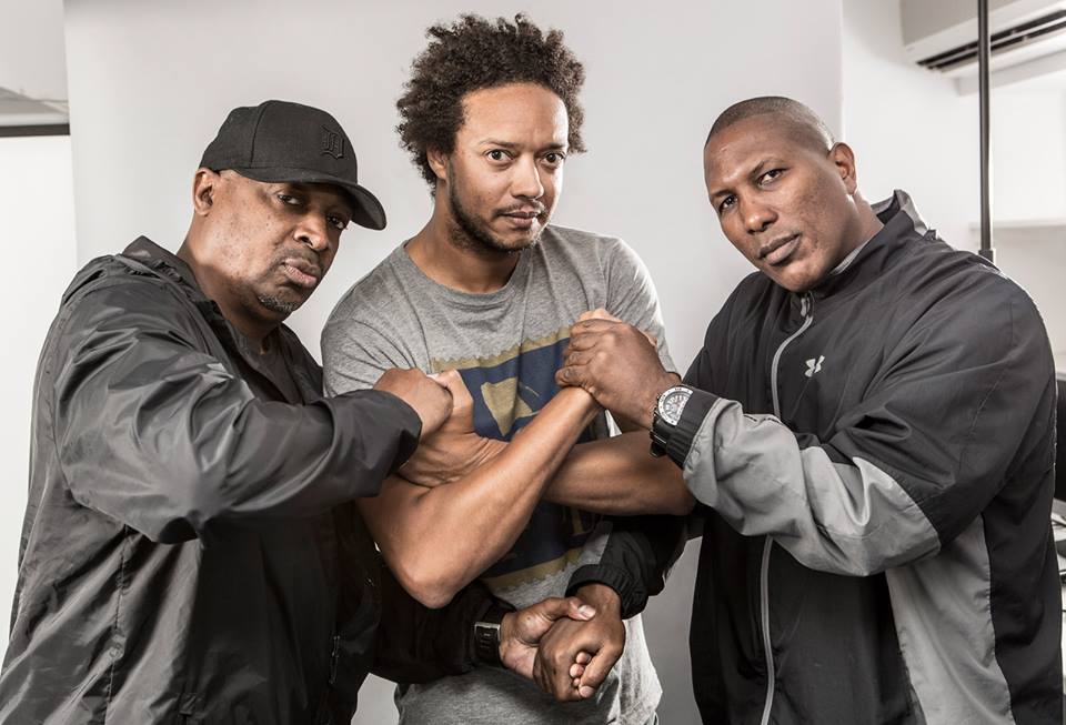 Madina (centre) with Public Enemy's Chuck D and S1W's James Bomb