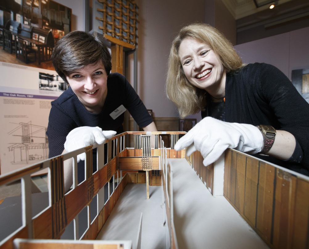 Mackintosh Tearoom Restoration at V&A Dundee's Scottish Design Galleries. Left Joanna Norman, Senior Curator, V&A and right Alison Brown Curator, European Decorative Art from 1800. At the Kelvingrove Musuem in Glasgow with a scaled model of the Oak Room. Picture Robert Perry 8th July 2015 Must credit photo to Robert Perry Image is free to use in connection with the promotion of the above company or organisation. 'Permissions for ALL other uses need to be sought and payment make be required. Note to Editors:  This image is free to be used editorially in the promotion of the above company or organisation.  Without prejudice ALL other licences without prior consent will be deemed a breach of copyright under the 1988. Copyright Design and Patents Act  and will be subject to payment or legal action, where appropriate. www.robertperry.co.uk NB -This image is not to be distributed without the prior consent of the copyright holder. in using this image you agree to abide by terms and conditions as stated in this caption. All monies payable to Robert Perry (PLEASE DO NOT REMOVE THIS CAPTION) This image is intended for Editorial use (e.g. news). Any commercial or promotional use requires additional clearance.  Copyright 2014 All rights protected. first use only contact details Robert Perry      07702 631 477 robertperryphotos@gmail.com         Robert Perry reserves the right to pursue unauthorised use of this image . If you violate my intellectual property you may be liable for  damages, loss of income, and profits you derive from the use of this image.