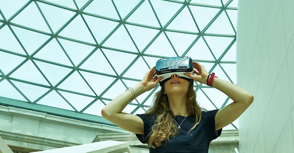 (i) Model wears a Samsung Gear VR headset in the British Museum’s Great Court. © The Trustees of the British Museum