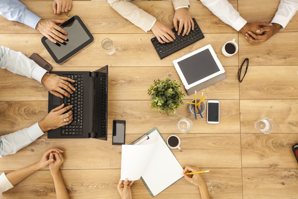 Group of business people by tbe office table