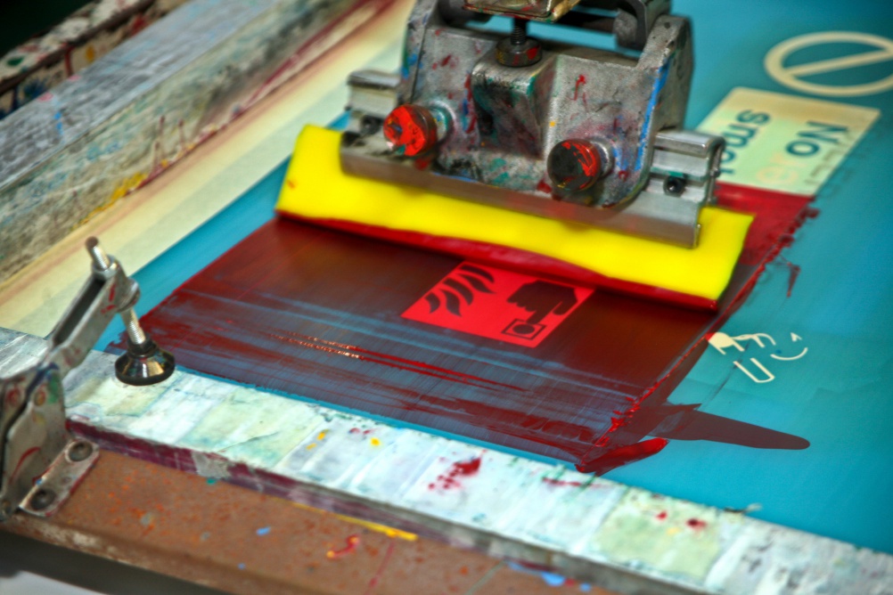 Print shop screen printing workshop. Making fire escape stickers. 