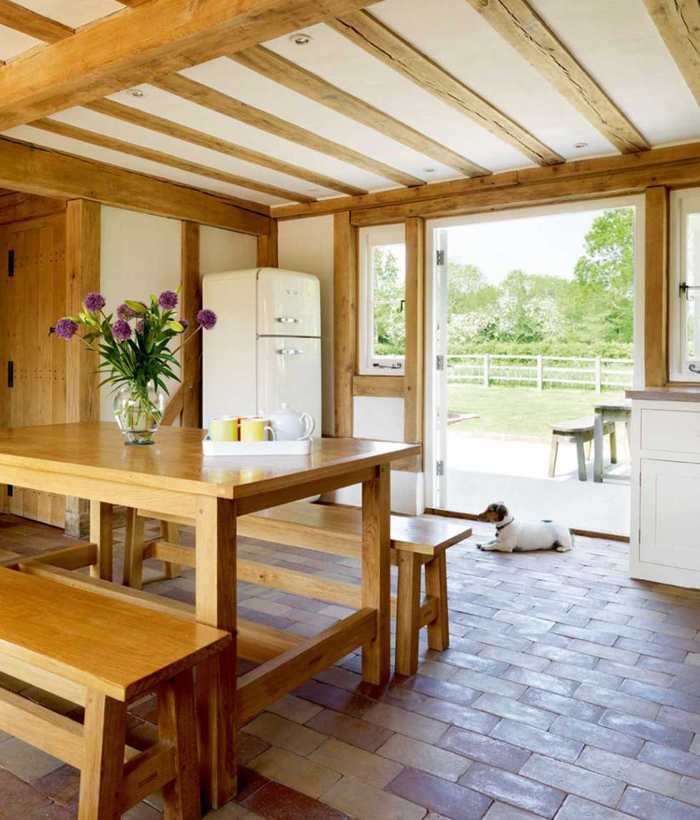 Wood framed glass doors lead from the kitchen out into the garden