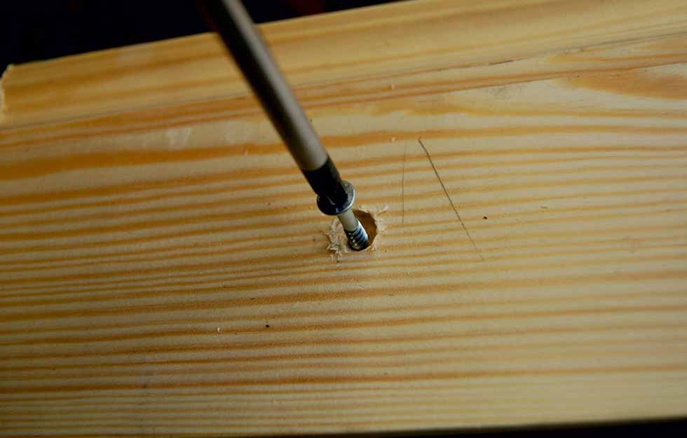 11. Screwing skirting board into wall