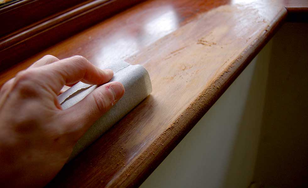 sanding down the window sill