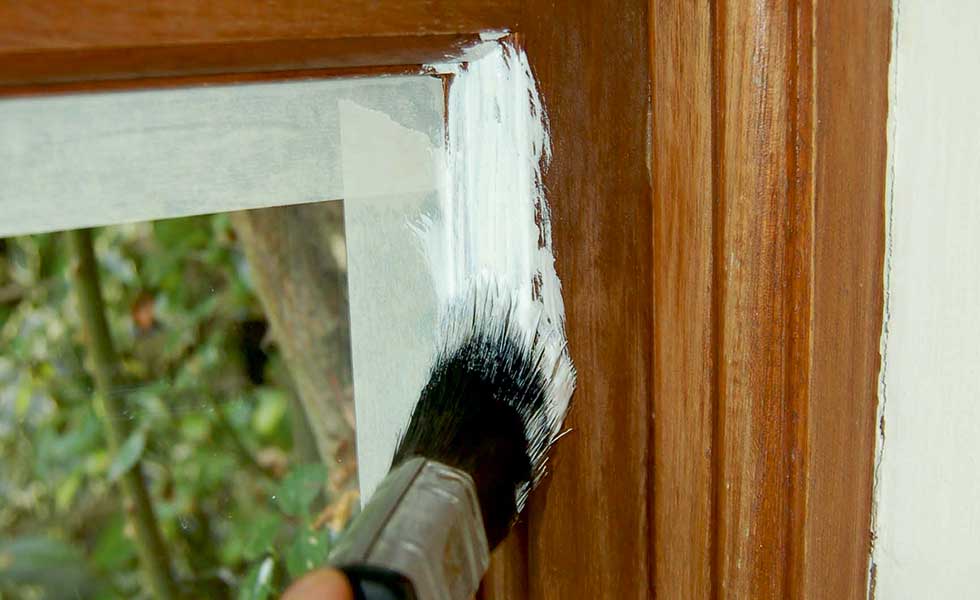 undercoat paint with paint brush round window