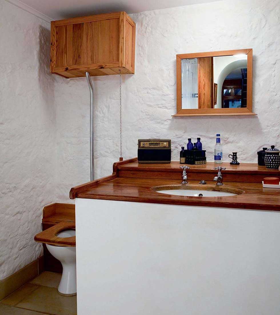 The bathroom furniture and high level cistern toilet