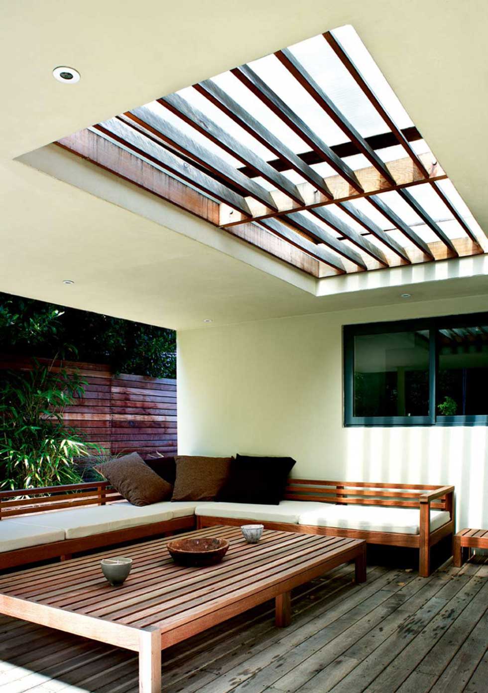 A garden room with wooden interiors and a rooflight