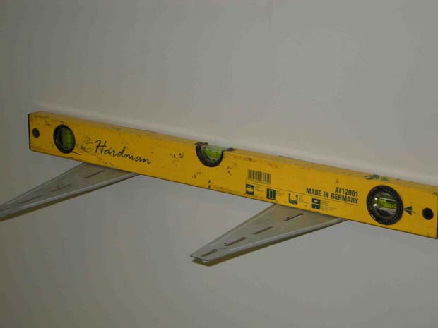 Make sure the wall brackets are level using a spirit level
