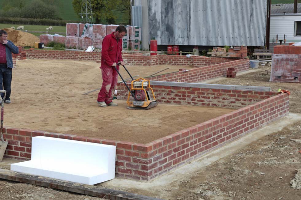 and then compacted using a whacker plate . . .