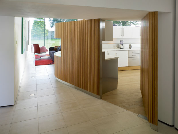 Varying ceiling heights and a large window are effective in this Gareth Hoskins home