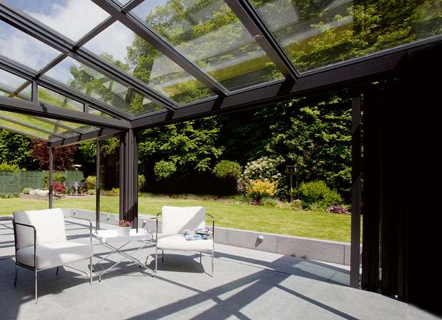 glazed roof on a sunroom leading to a garden
