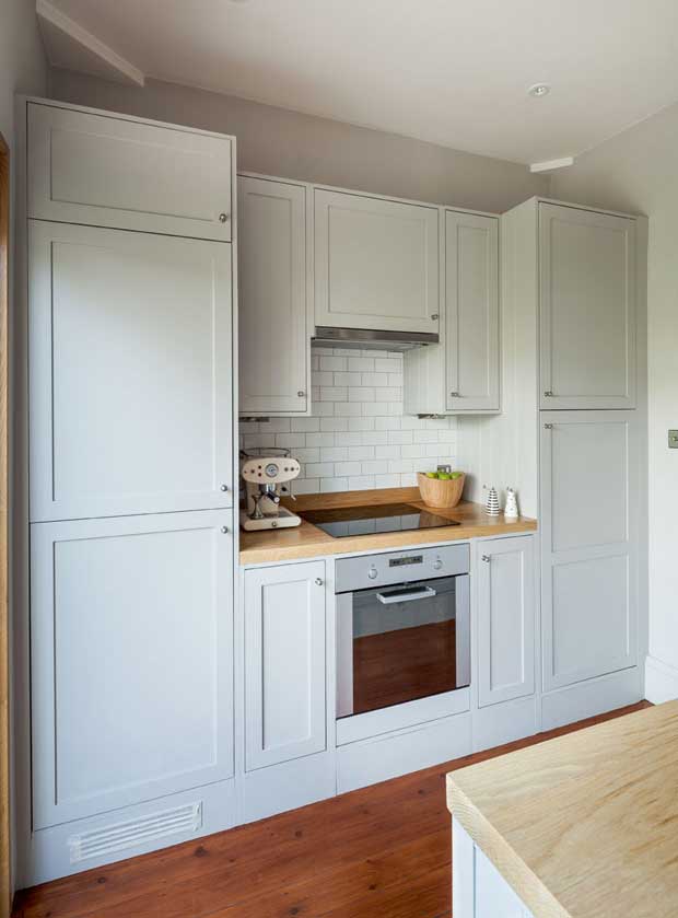 The kitchen exhibits modern and traditional features