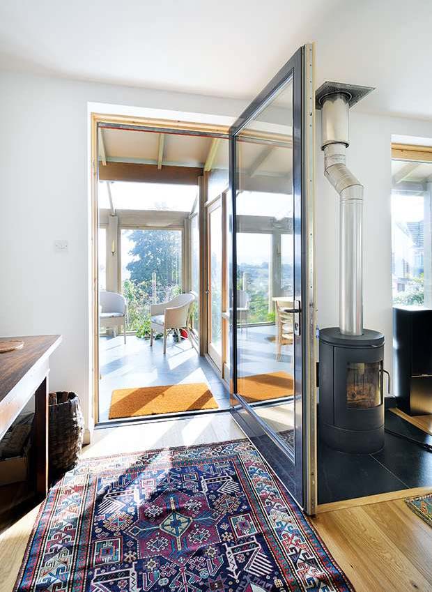 Woodburner and dorrway to the garden room