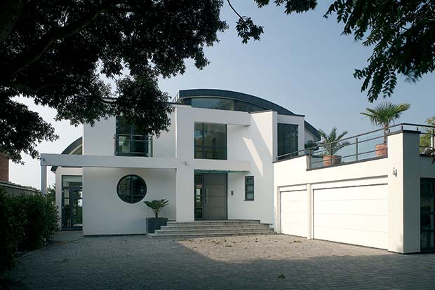 a modernist home with garage and roof terrace