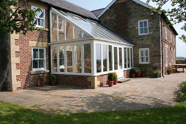 Totali Timber sunroom with knee-wall brick