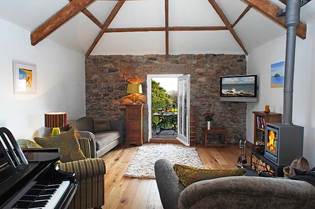 Snug with door to the terrace in a loft conversion in Padstow cornwall with exposed stone walls and beams