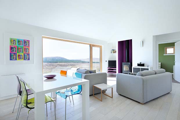 The interiors of White Tail Croft with a large window with panoramic views
