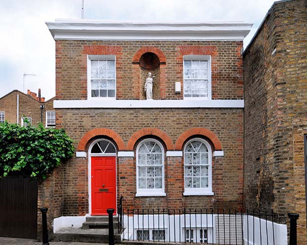 A period property and an adjoining damaged wall