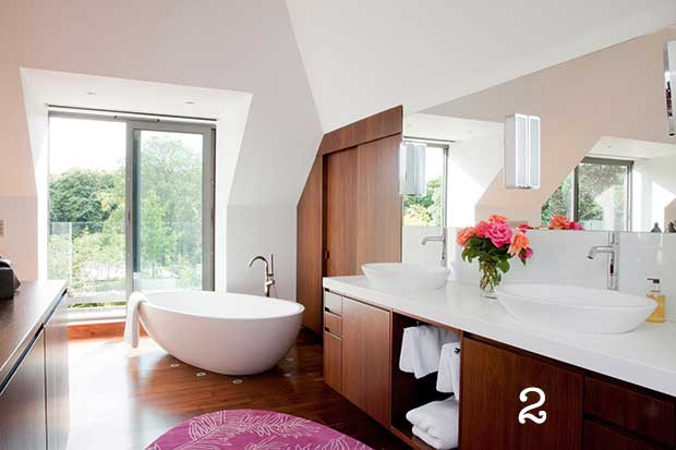Bathroom in loft with storage space under roof slope