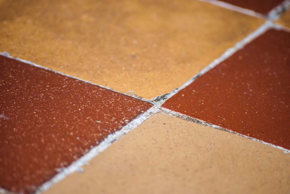 Close up of sealant between floor tiles