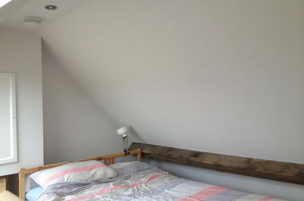 Exposed beam in the loft bedroom