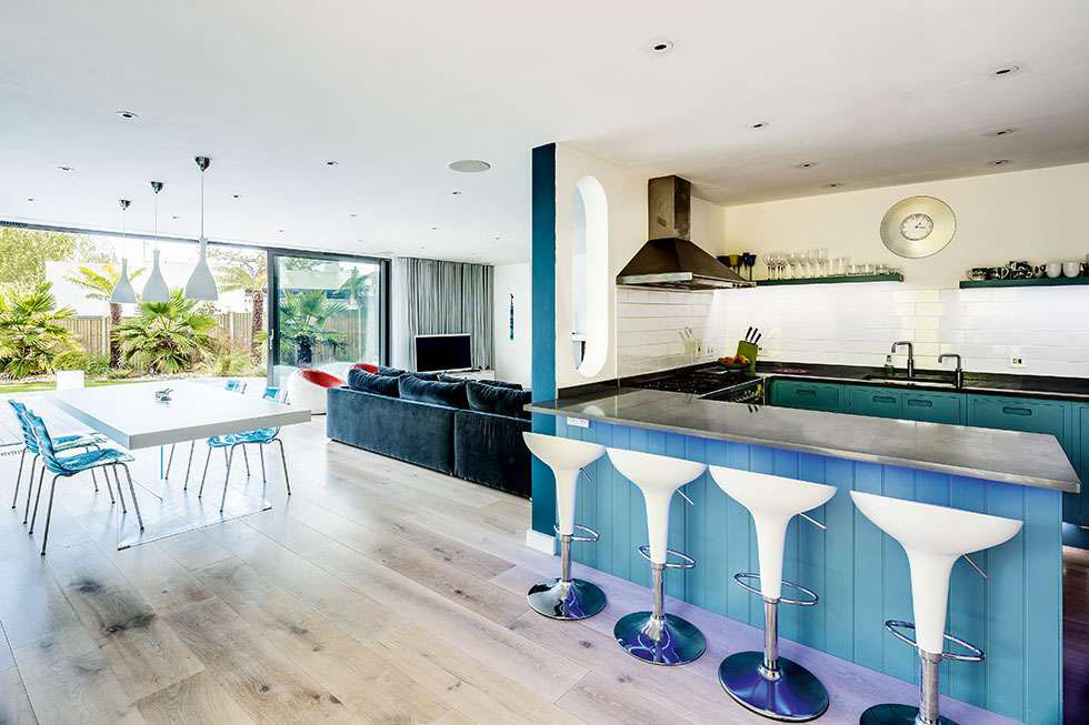 Modern entertaining is key in this 1930s home, with fun touches from retro accents to coloured lighting below the breakfast bar counter. View Project →