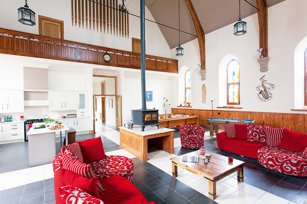 A relaxed open plan scheme is offered, with a stove acting as a focal point to warm this converted church and ensure a cosy seating area. View Project →