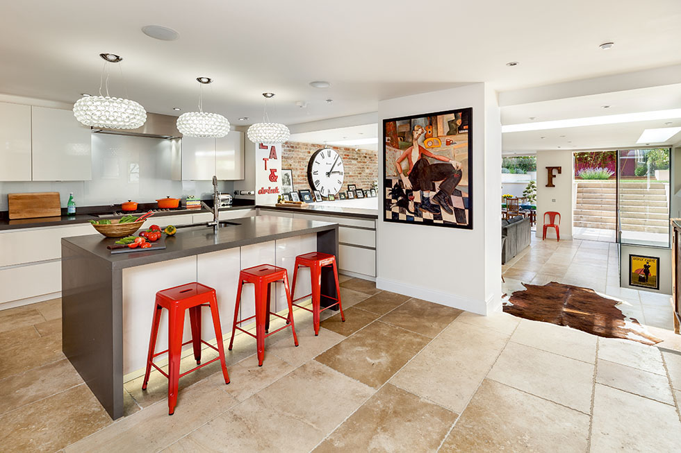 This kitchen is on a higher level to the rest of the open plan dining/sitting area, having originally been two separate rooms, opened up with concealed structural steelwork. View Project →