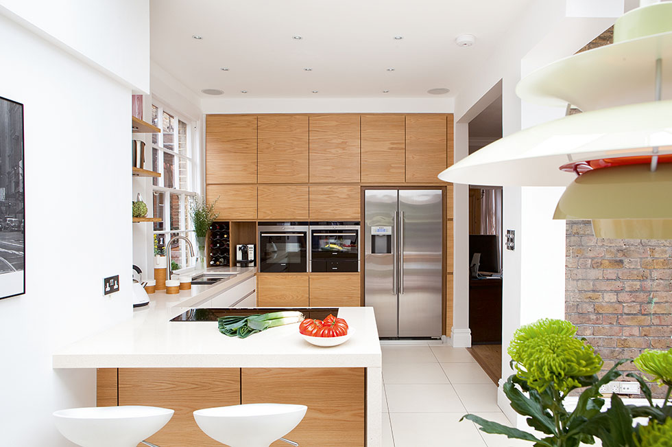 High quality plywood built-in units have been paired with hardwearing DuPont Zodiaq ‘Cygnus Pearl’ worktops to create a simple but stylish aesthetic. View Project →