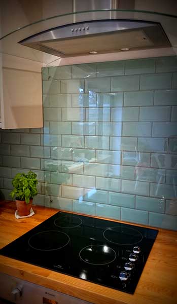 kitchen splash back over duck egg blue tiles with cooker hood