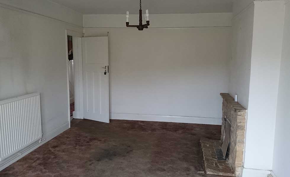 living room before shot with stone fire surround