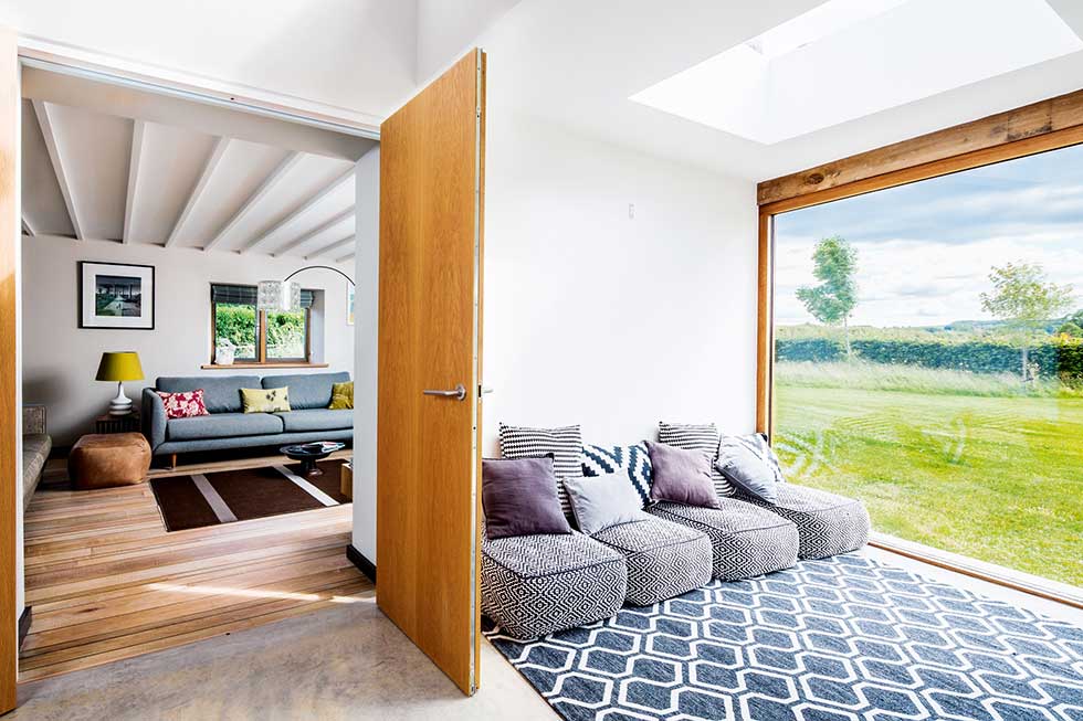 Old cottage extension glazed corridor to living room
