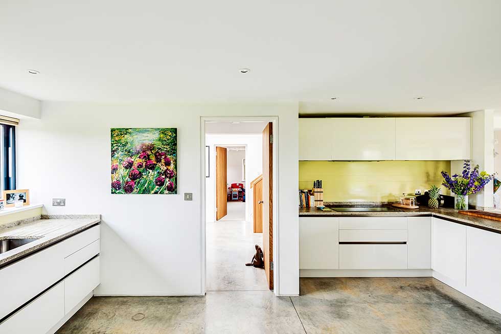 Old cottage extension open plan kitchen diner yellow splashback