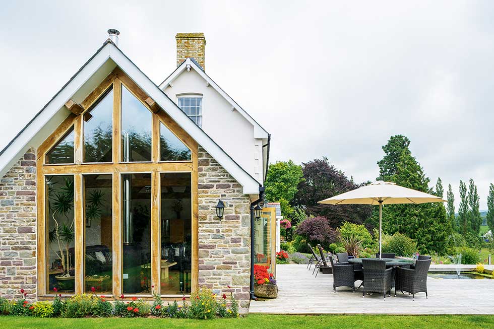 self build home exterior a frame with glazing