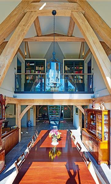 Oakwrights timber frame home double height dining room mezzanine