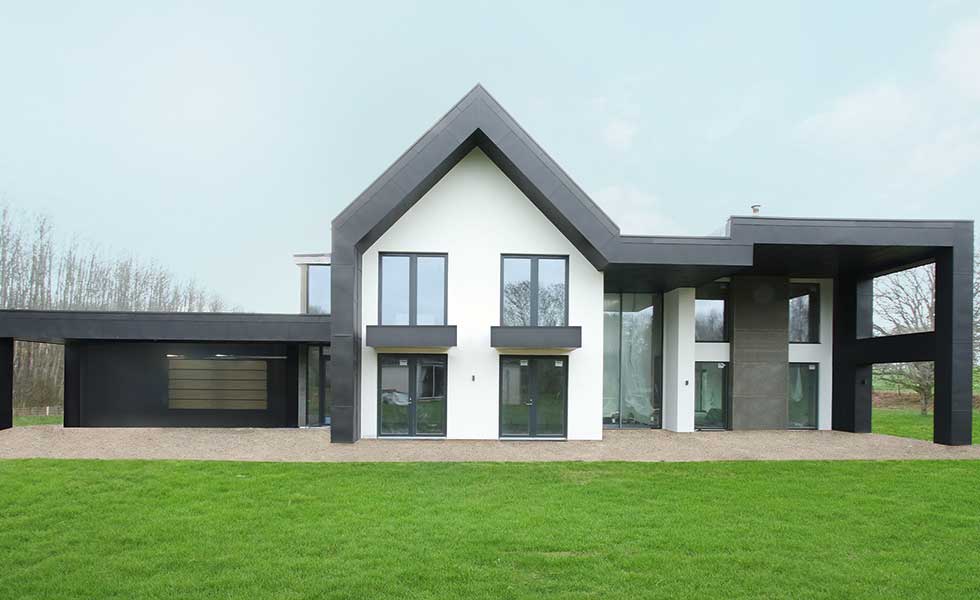a solar powered house in kent with black metal structural features