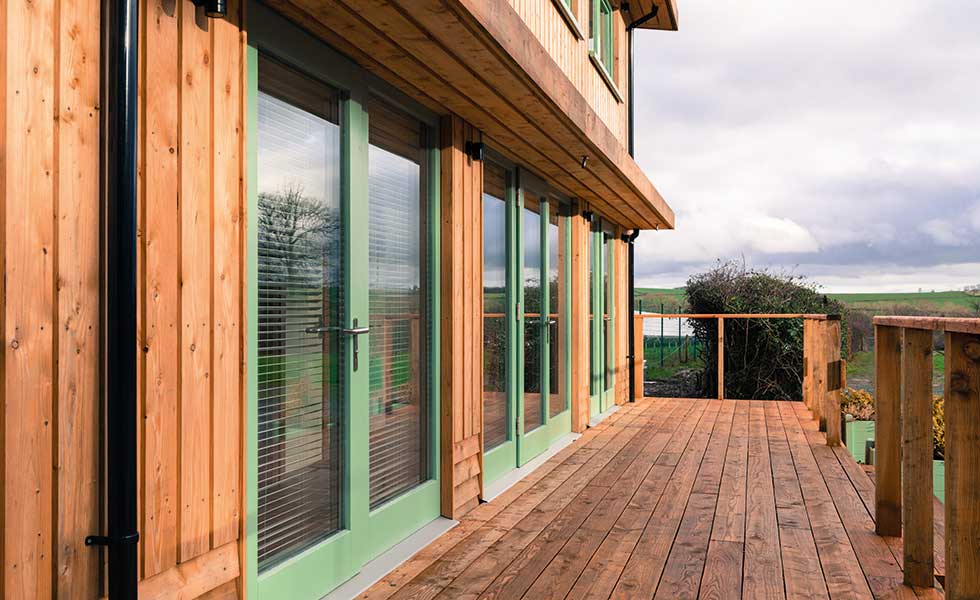 close up of the glazing on ty solar house in wales