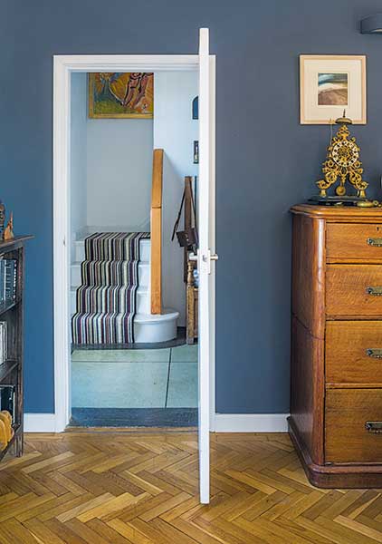 blue living room with parquet floor