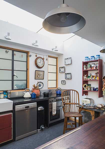 kitchen with mahogany shop counter, stainless steel worktops and freestanding furniture