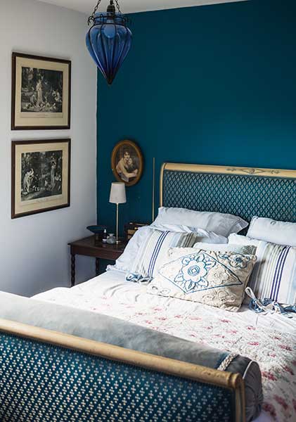 teal bedroom with sleigh bed