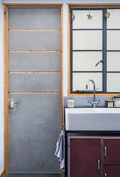 upcycled kitchen with metal clad door